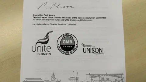 A photograph of the bottom of a typed, signed letter. "Councillor Paul Moore... on behalf of Sandwell Council and the GMB, Unison and Unite trade unions" 